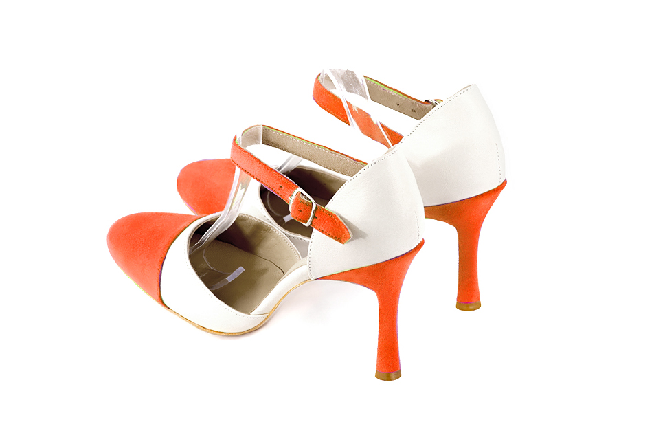French elegance and refinement for these clementine orange and off white dress open side shoes, with an instep strap, 
                available in many subtle leather and colour combinations. Its high vamp and fitted strap will give you good support.
To personalize or not, according to your inspiration and your needs.  
                Matching clutches for parties, ceremonies and weddings.   
                You can customize these shoes to perfectly match your tastes or needs, and have a unique model.  
                Choice of leathers, colours, knots and heels. 
                Wide range of materials and shades carefully chosen.  
                Rich collection of flat, low, mid and high heels.  
                Small and large shoe sizes - Florence KOOIJMAN